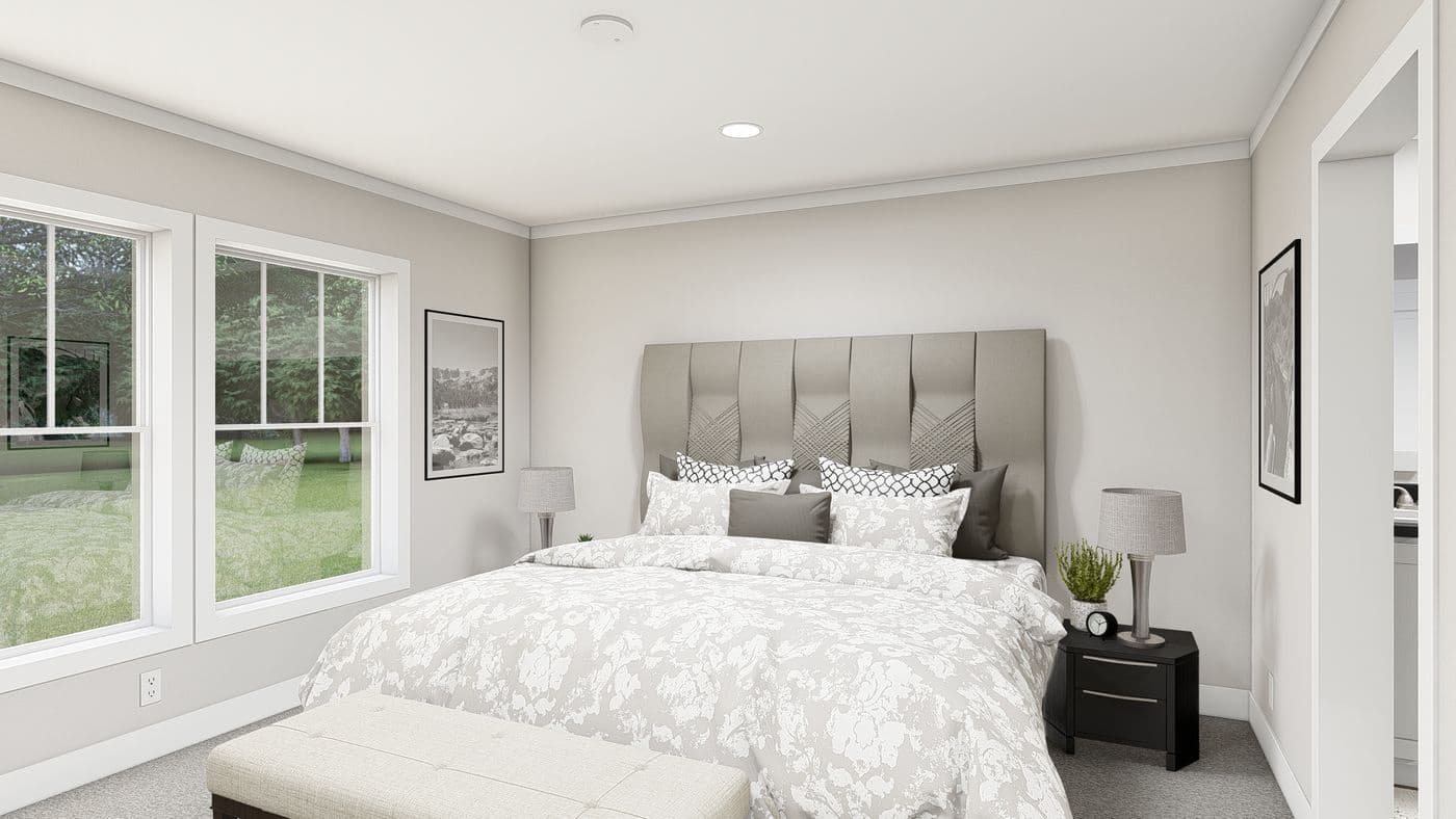 The LEAN ON ME Primary Bedroom. This Manufactured Mobile Home features 3 bedrooms and 2 baths.