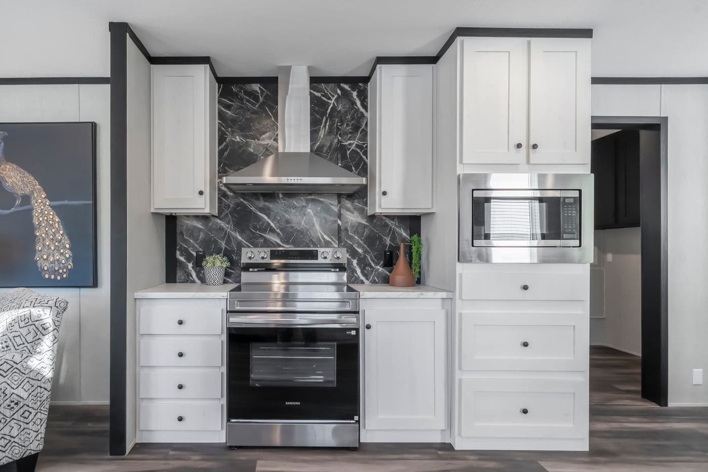 The LIL SOUTHERN CHARM Kitchen. This Manufactured Mobile Home features 3 bedrooms and 2 baths.