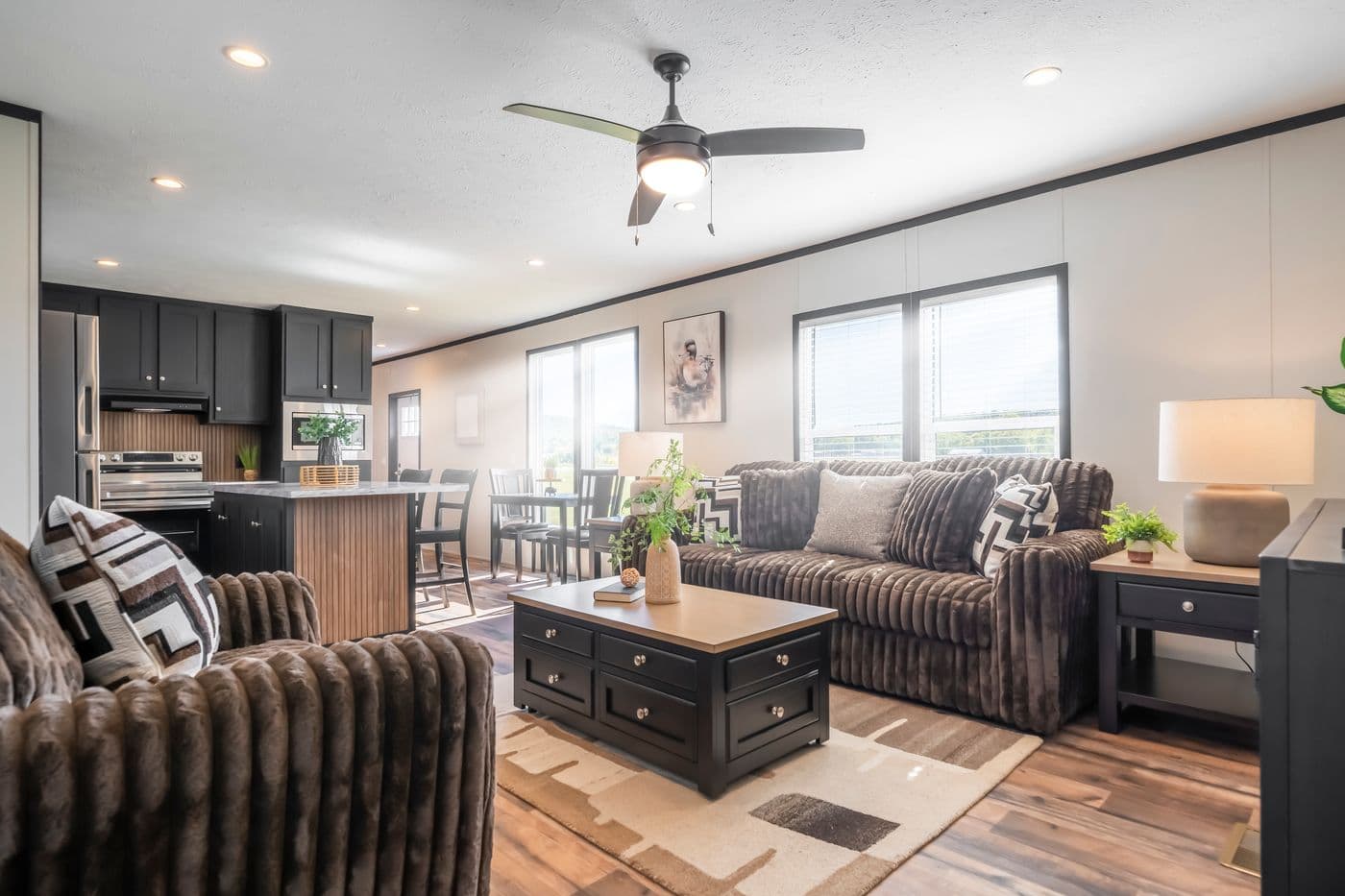 The RAVENWOOD Living Room. This Manufactured Mobile Home features 3 bedrooms and 2 baths.