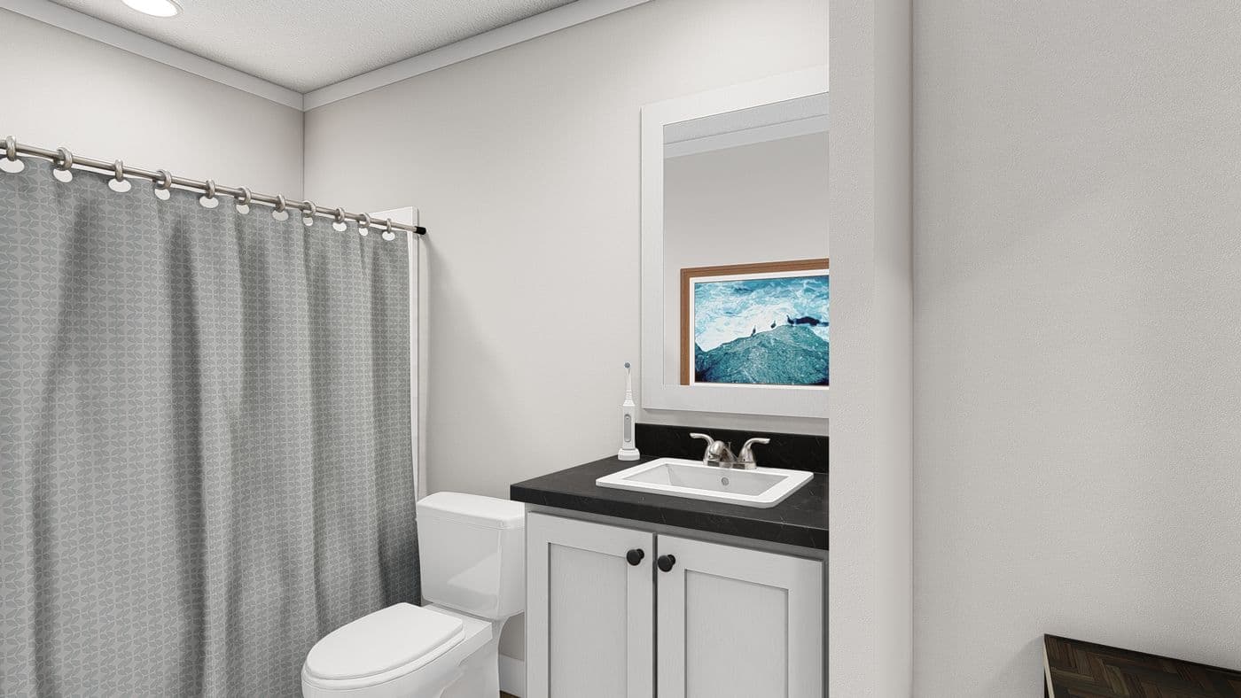 The THREE LITTLE BIRDS Guest Bathroom. This Manufactured Mobile Home features 3 bedrooms and 2 baths.