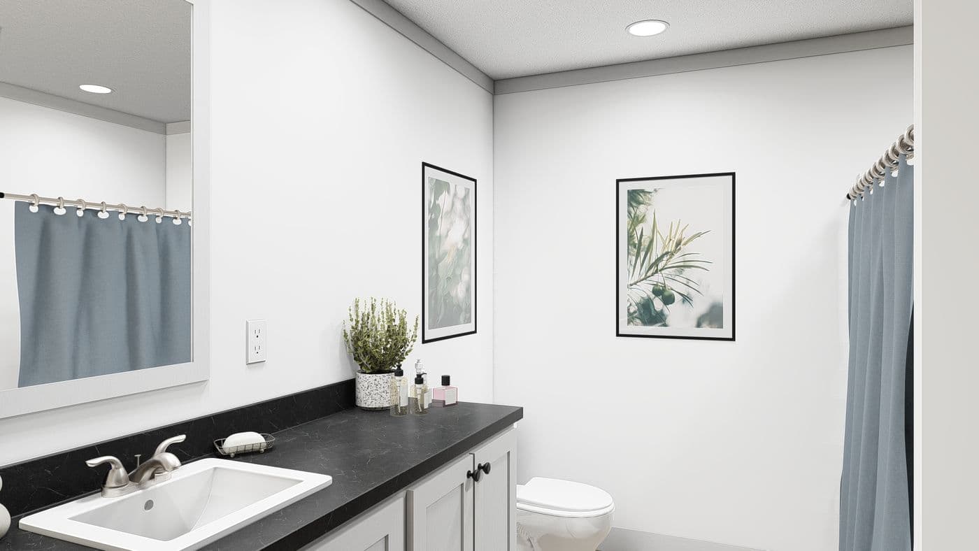 The WONDERFUL WORLD Guest Bathroom. This Manufactured Mobile Home features 3 bedrooms and 2 baths.