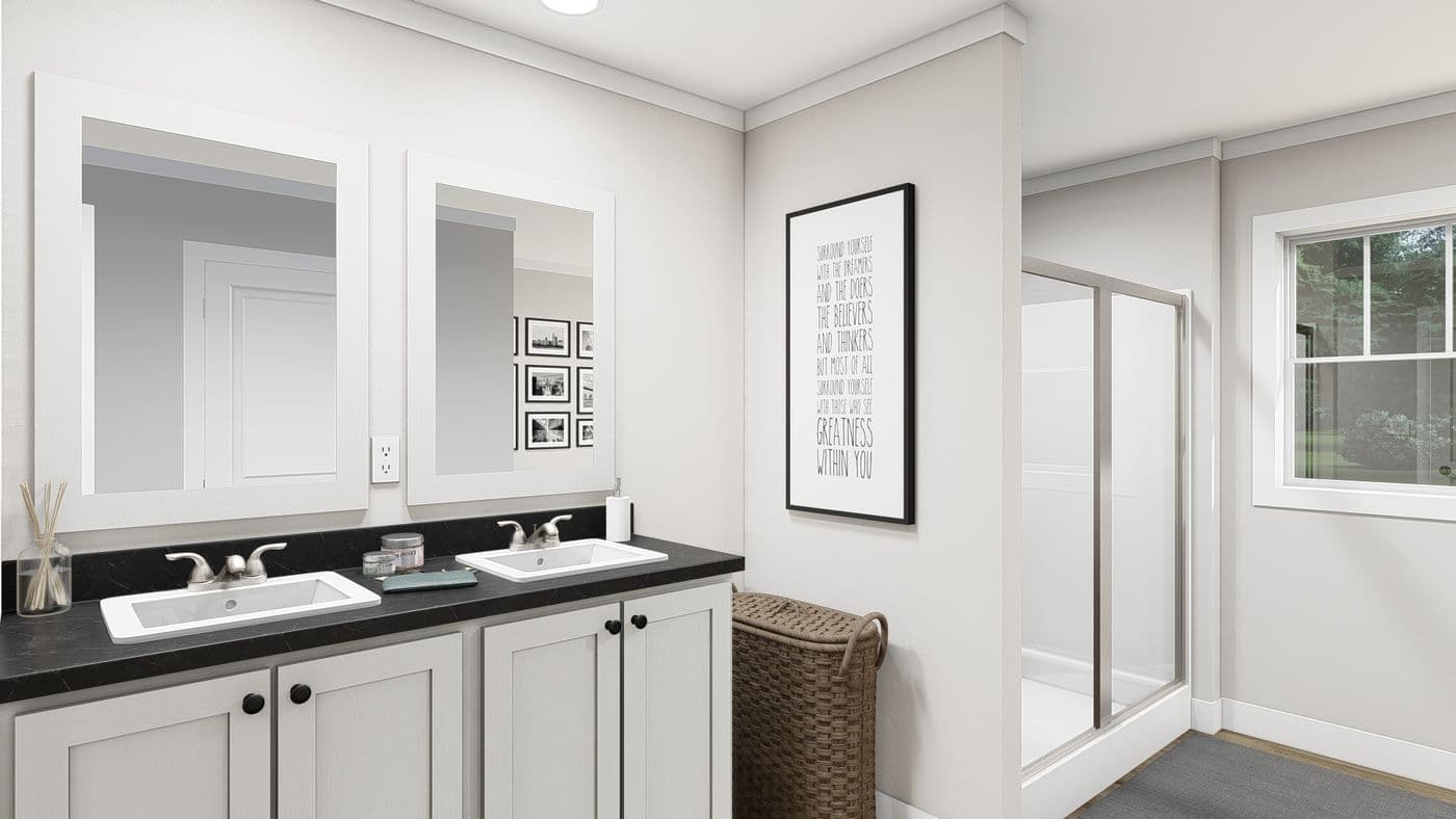 The LEAN ON ME Primary Bathroom. This Manufactured Mobile Home features 3 bedrooms and 2 baths.