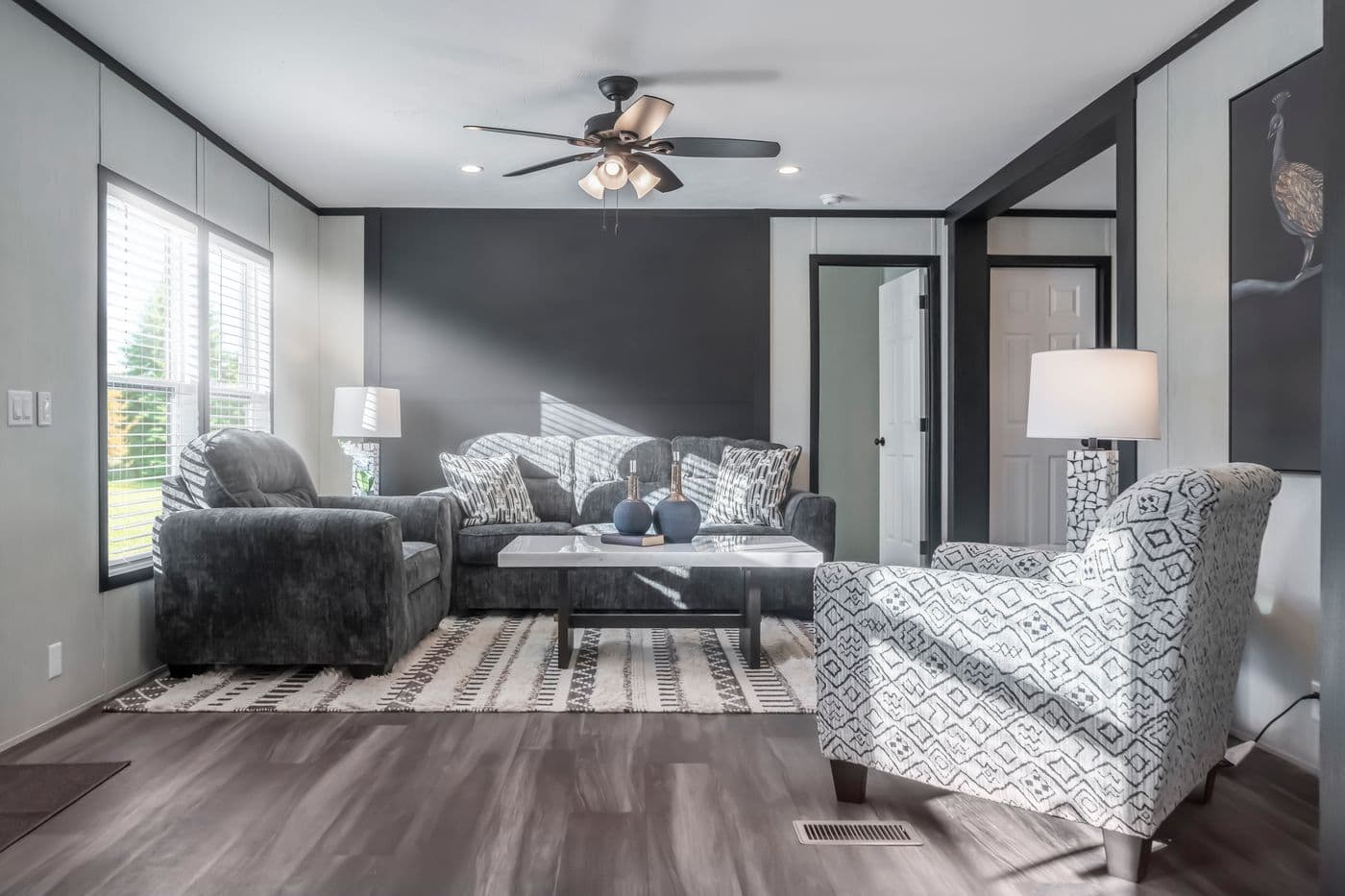 The LIL SOUTHERN CHARM Living Room. This Manufactured Mobile Home features 3 bedrooms and 2 baths.