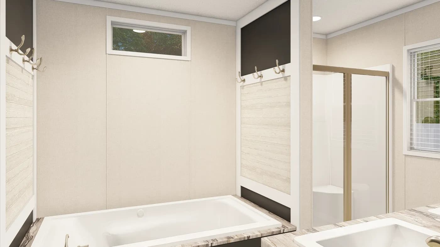 The GRAND LIVING 76B Primary Bathroom. This Manufactured Mobile Home features 3 bedrooms and 2 baths.