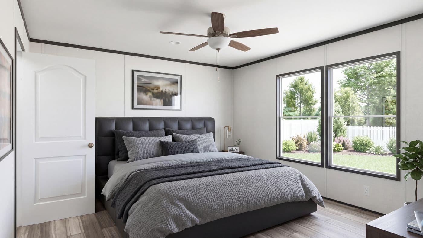 The THE MOUNTAINEER 56 Primary Bedroom. This Manufactured Mobile Home features 3 bedrooms and 2 baths.