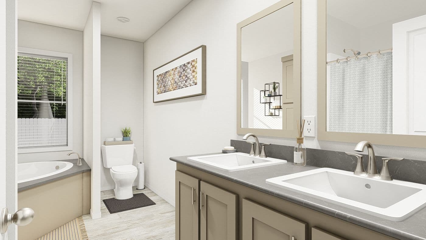 The DRM601F 60' DREAM Primary Bathroom. This Manufactured Mobile Home features 4 bedrooms and 2 baths.