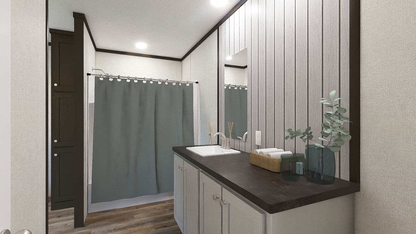 The REVEAL Primary Bathroom. This Manufactured Mobile Home features 3 bedrooms and 2 baths.