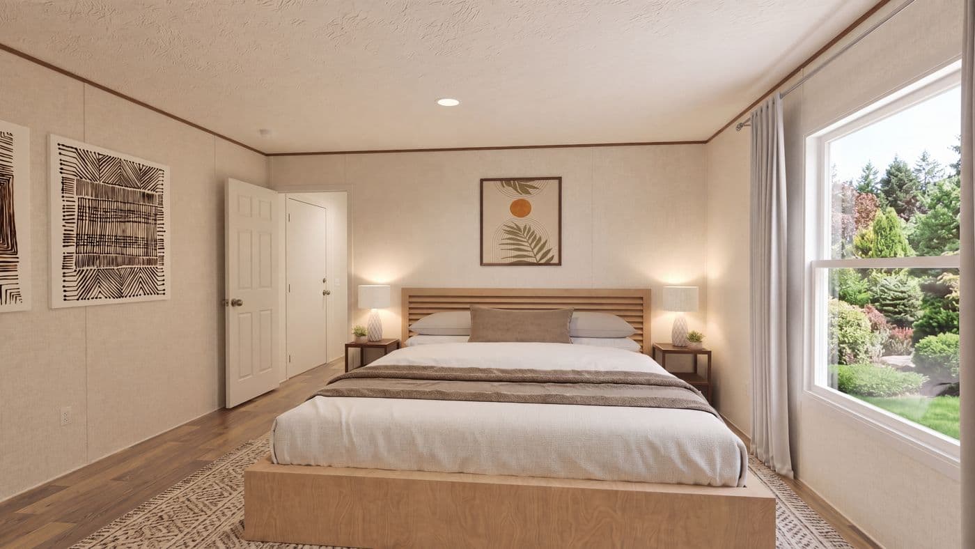 The MAGNOLIA Primary Bedroom. This Manufactured Mobile Home features 3 bedrooms and 2 baths.