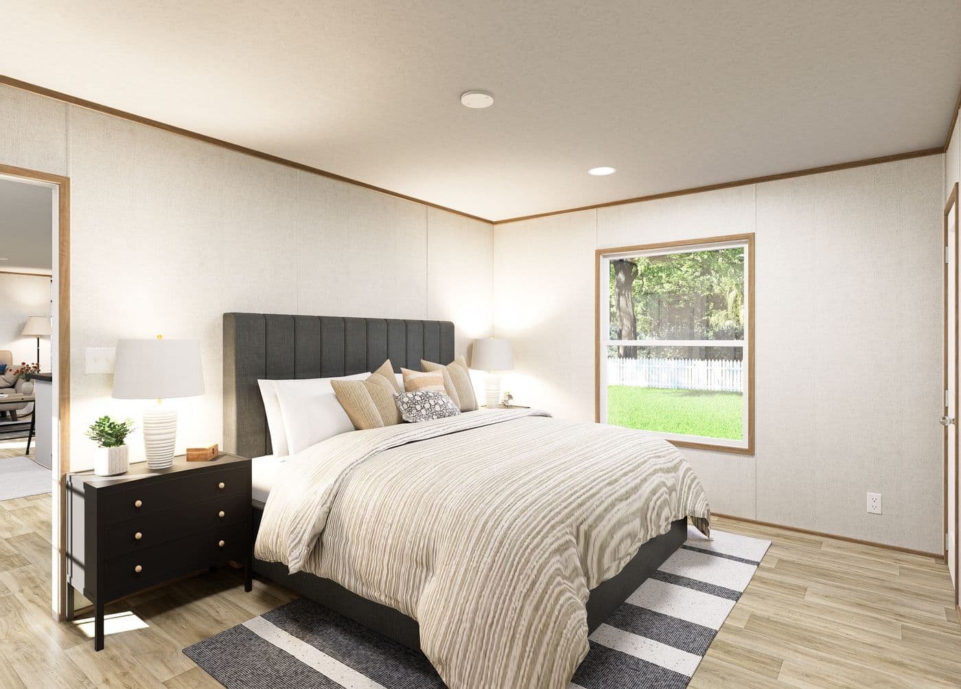 The EMBER Primary Bedroom. This Manufactured Mobile Home features 2 bedrooms and 2 baths.