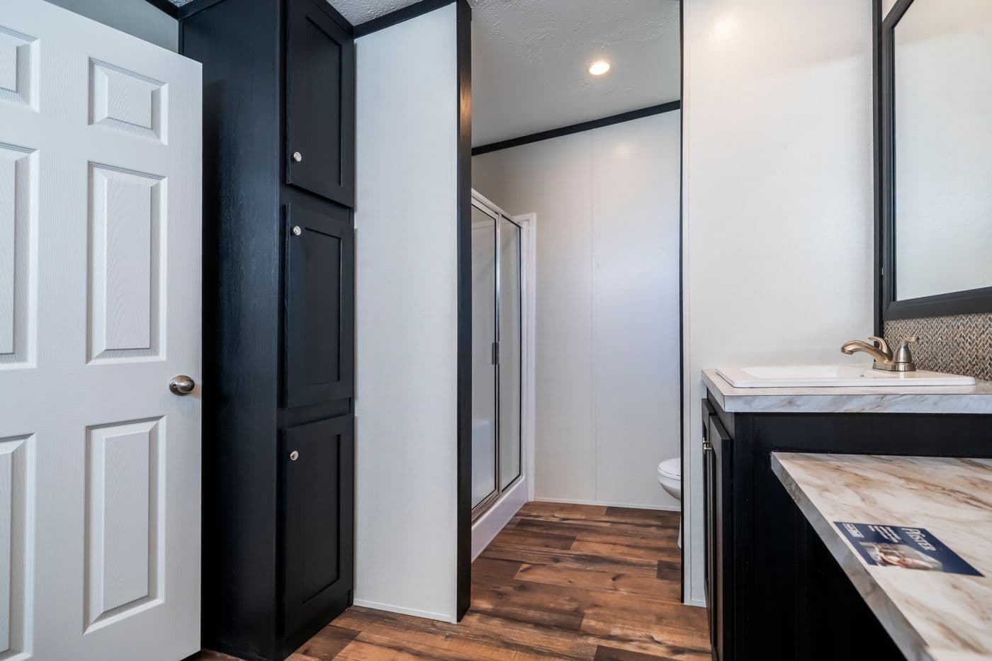The RAVENWOOD Primary Bathroom. This Manufactured Mobile Home features 3 bedrooms and 2 baths.