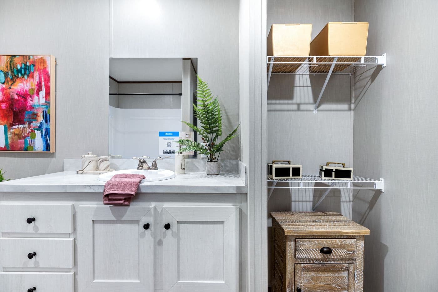 The HOMESTEAD 16763A Primary Bathroom. This Manufactured Mobile Home features 3 bedrooms and 2 baths.