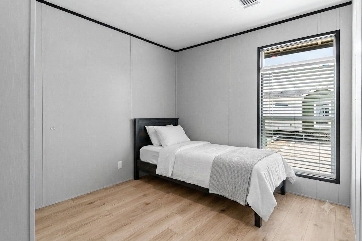The RESOLUTION 16803B Bedroom. This Manufactured Mobile Home features 3 bedrooms and 2 baths.