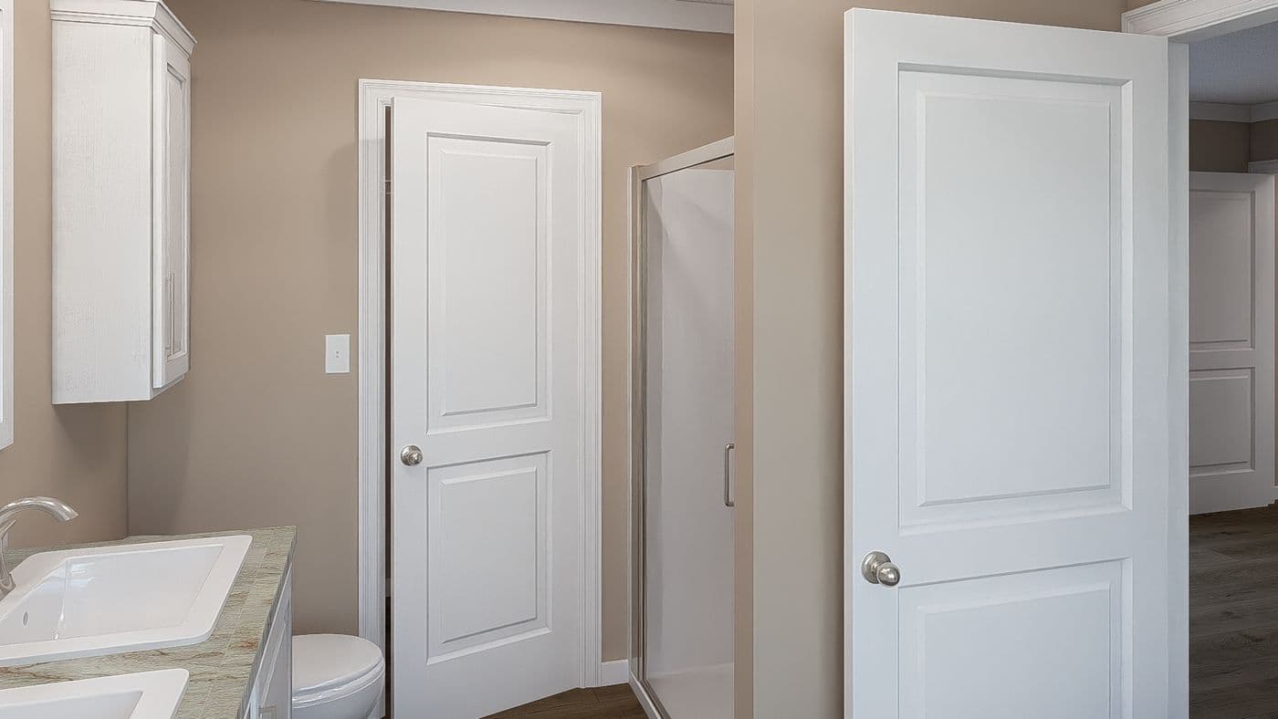 The THE DREAM Primary Bathroom. This Manufactured Mobile Home features 3 bedrooms and 2 baths.