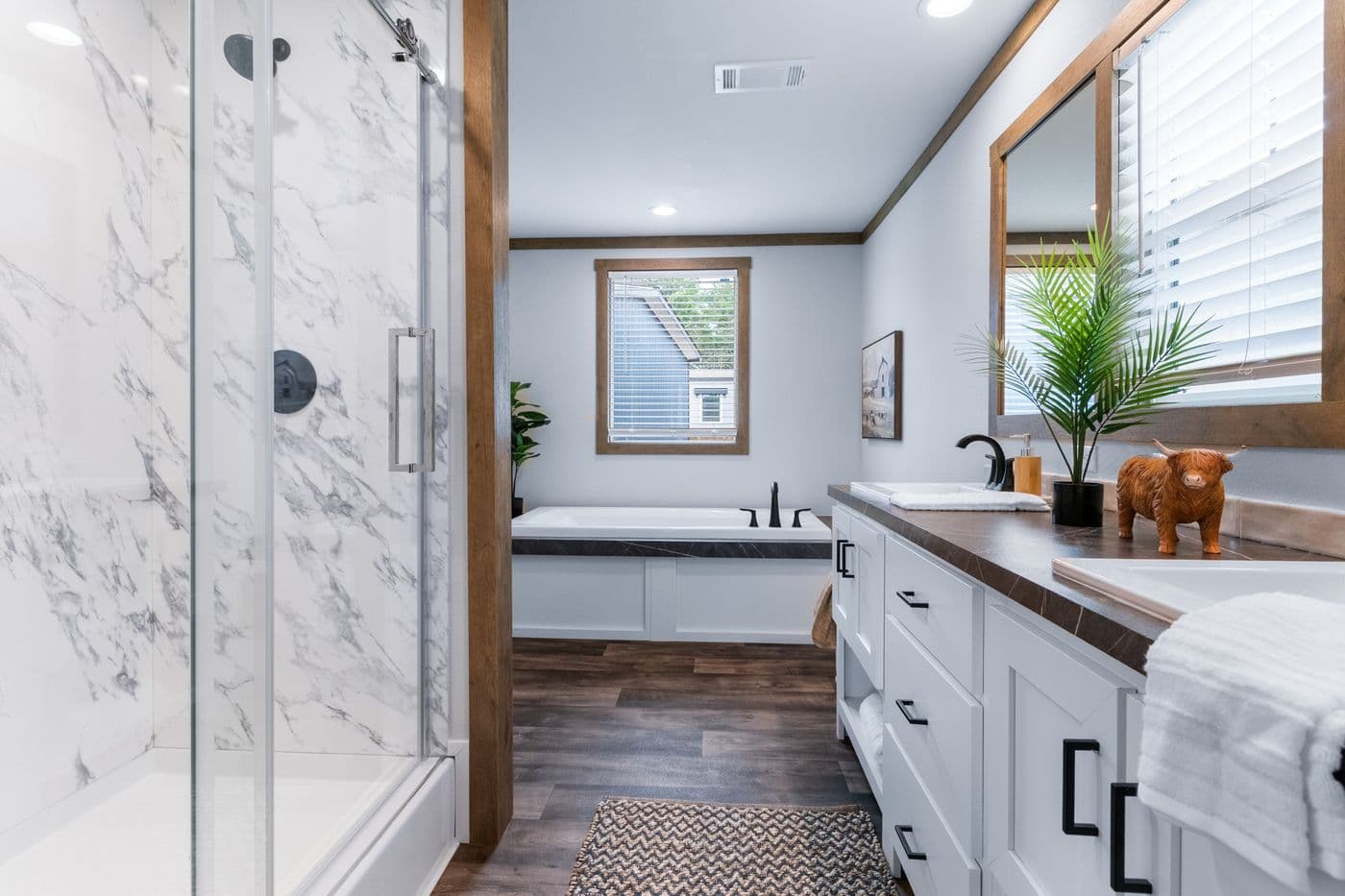 The SAWYER ELITE Primary Bathroom. This Manufactured Mobile Home features 3 bedrooms and 2 baths.