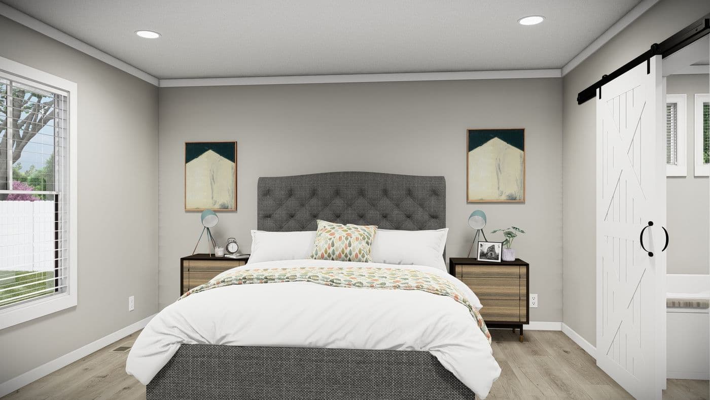 The THE REVERE Primary Bedroom. This Manufactured Mobile Home features 4 bedrooms and 2 baths.