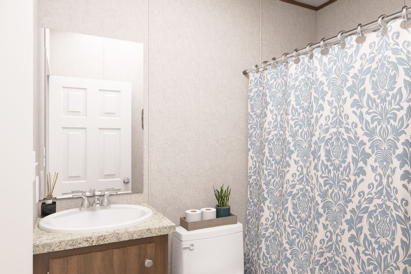 The HICKORY Guest Bathroom. This Manufactured Mobile Home features 3 bedrooms and 2 baths.