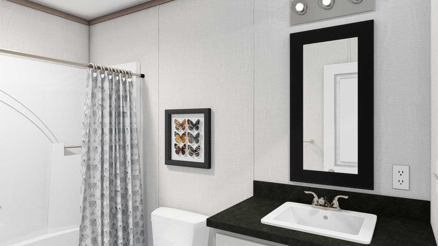 The 4428-E781 THE PULSE Guest Bathroom. This Manufactured Mobile Home features 3 bedrooms and 2 baths.