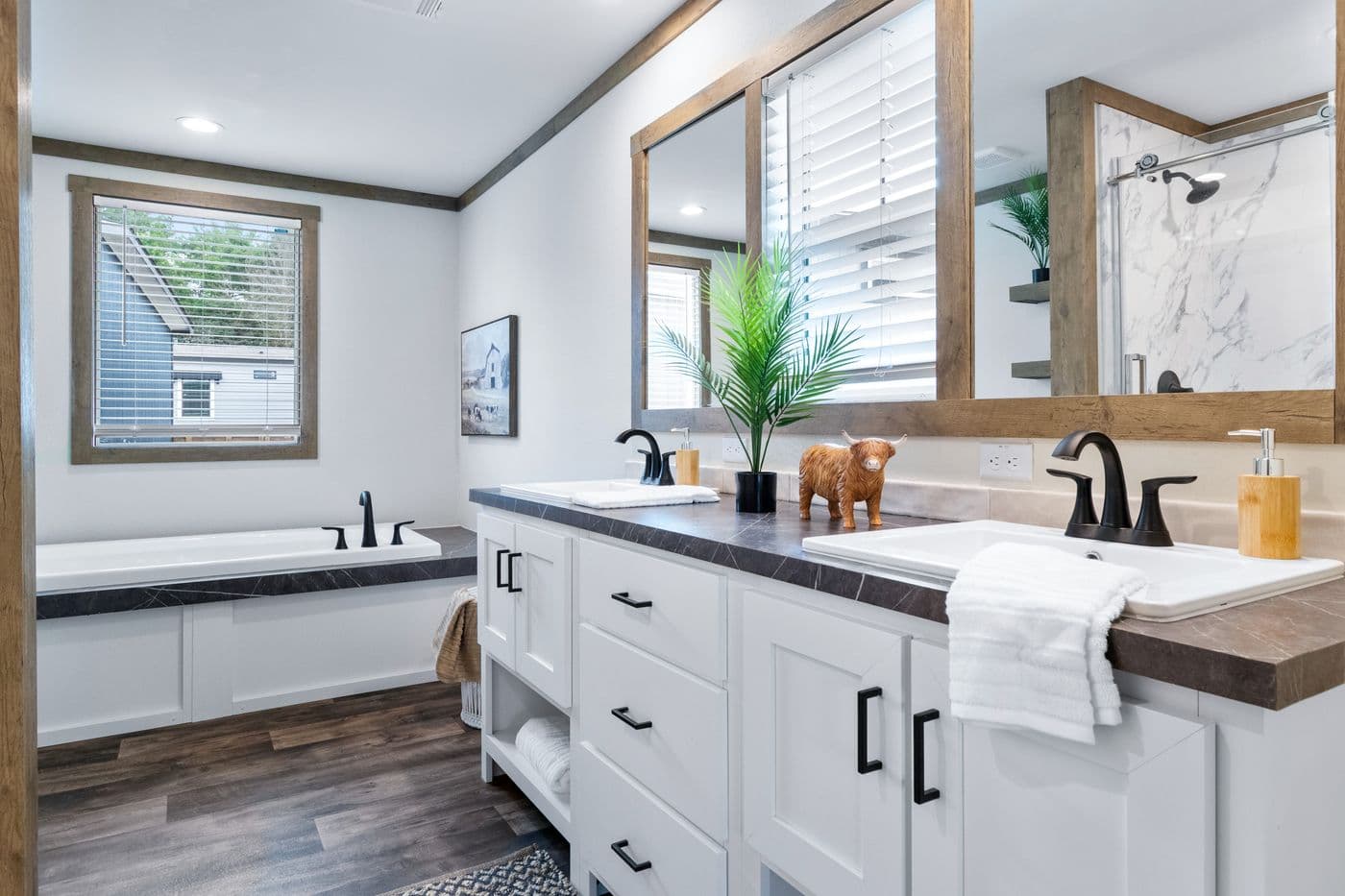 The SAWYER ELITE Primary Bathroom. This Manufactured Mobile Home features 3 bedrooms and 2 baths.