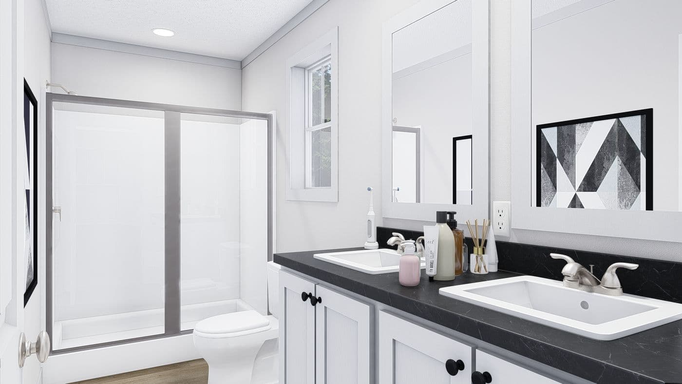 The JOHNNY B GOODE Primary Bathroom. This Manufactured Mobile Home features 3 bedrooms and 2 baths.