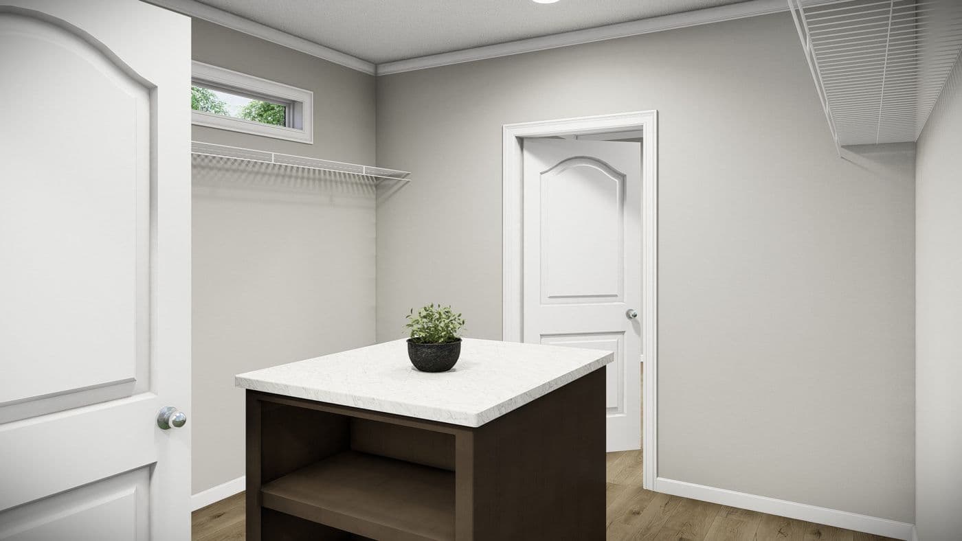 The HUXTON II Primary Bedroom. This Manufactured Mobile Home features 4 bedrooms and 2 baths.
