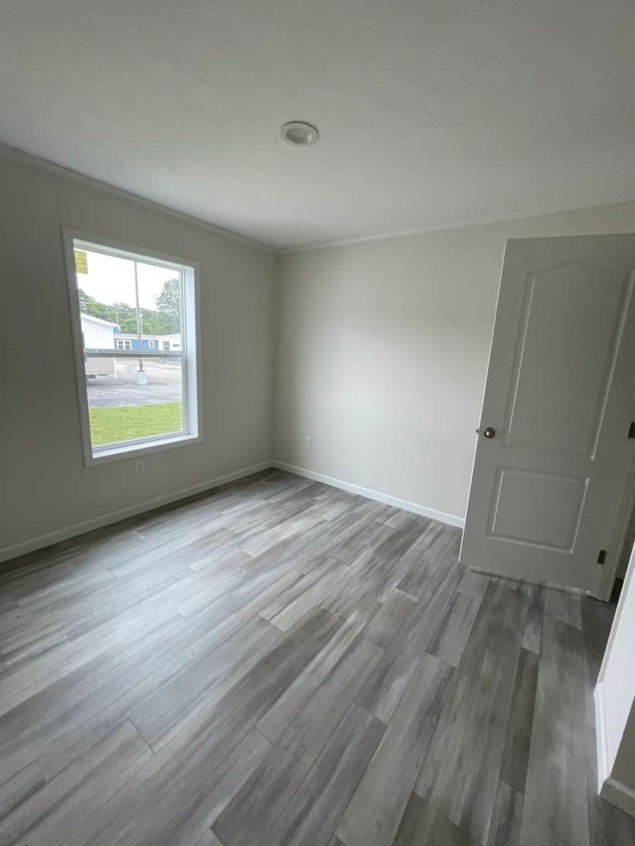 The MOONSTONE Guest Bedroom. This Manufactured Mobile Home features 3 bedrooms and 2 baths.