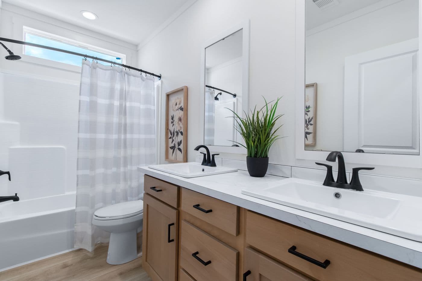The THE VALENTINO Primary Bathroom. This Manufactured Mobile Home features 4 bedrooms and 2.5 baths.