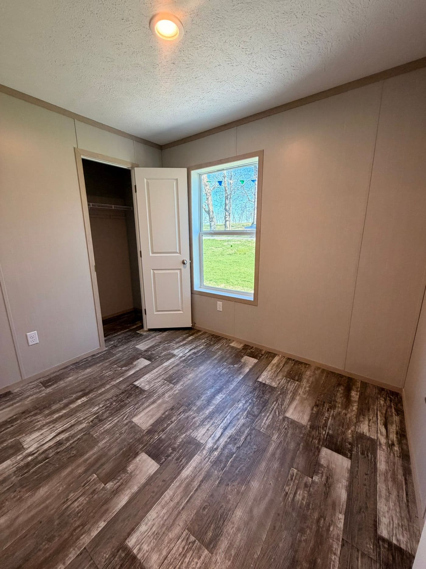 The JEFFERSON Guest Bedroom. This Manufactured Mobile Home features 3 bedrooms and 2 baths.