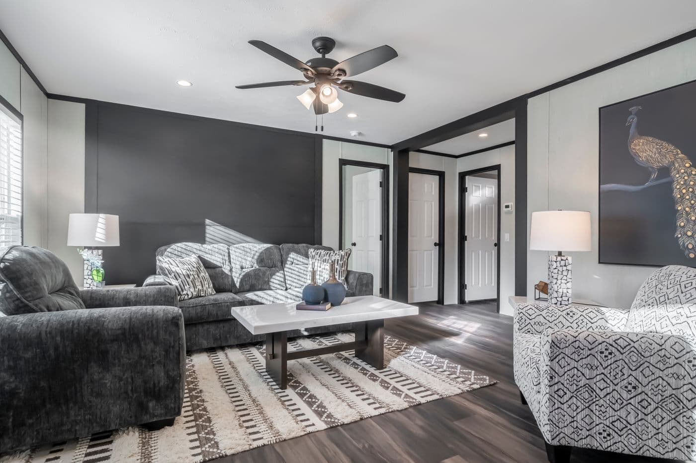 The LIL SOUTHERN CHARM Living Room. This Manufactured Mobile Home features 3 bedrooms and 2 baths.
