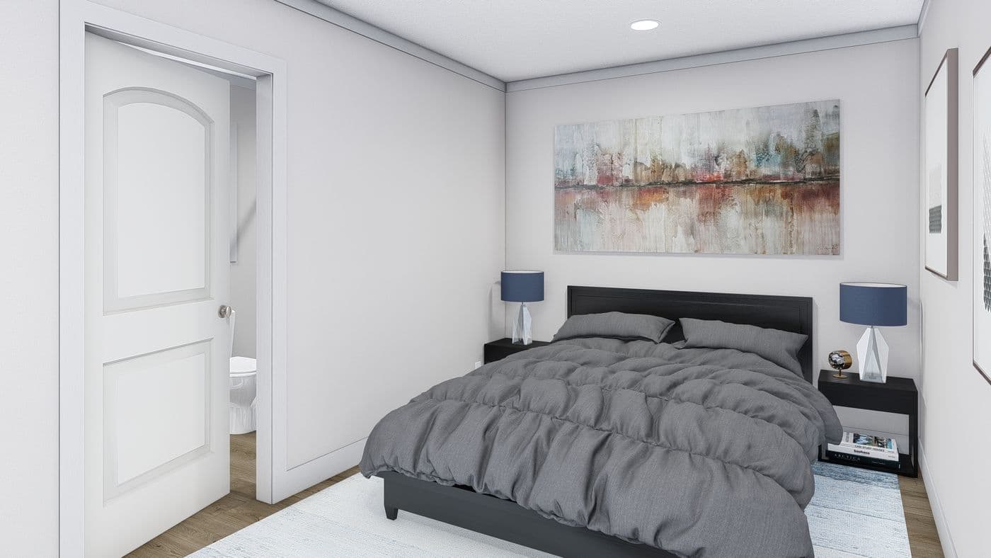 The STILL THE ONE Primary Bedroom. This Manufactured Mobile Home features 2 bedrooms and 2 baths.