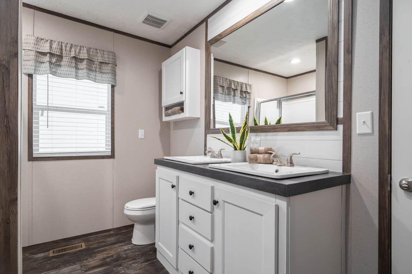 The THE GENERAL Primary Bathroom. This Manufactured Mobile Home features 3 bedrooms and 2 baths.