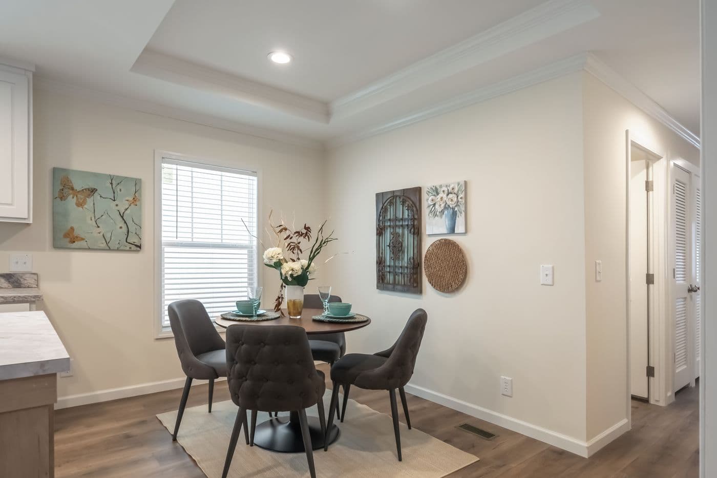 The 4210 "CAROLINA" 5628 Dining Area. This Manufactured Mobile Home features 3 bedrooms and 2 baths.