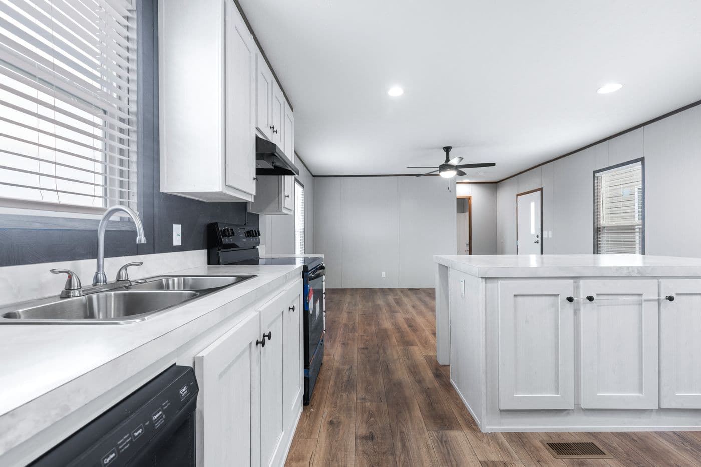 The HOMESTEAD 16602A Kitchen. This Manufactured Mobile Home features 2 bedrooms and 2 baths.