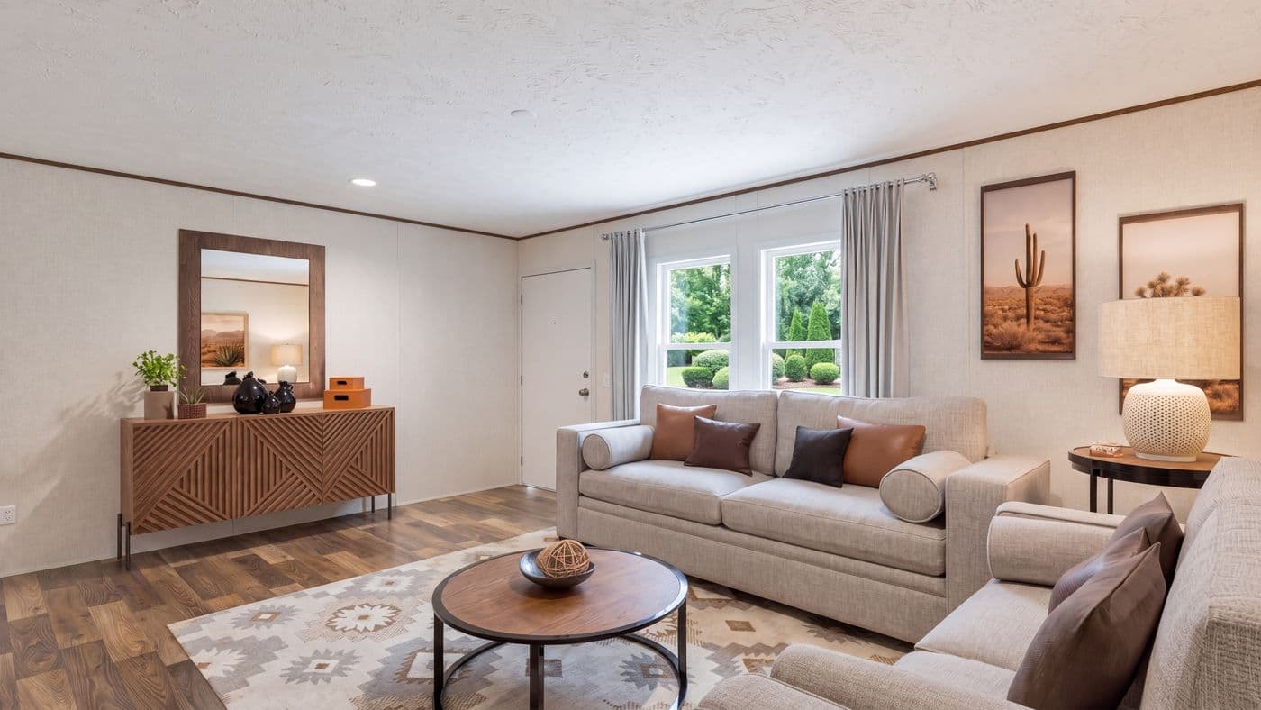 The CEDAR Living Room. This Manufactured Mobile Home features 3 bedrooms and 2 baths.