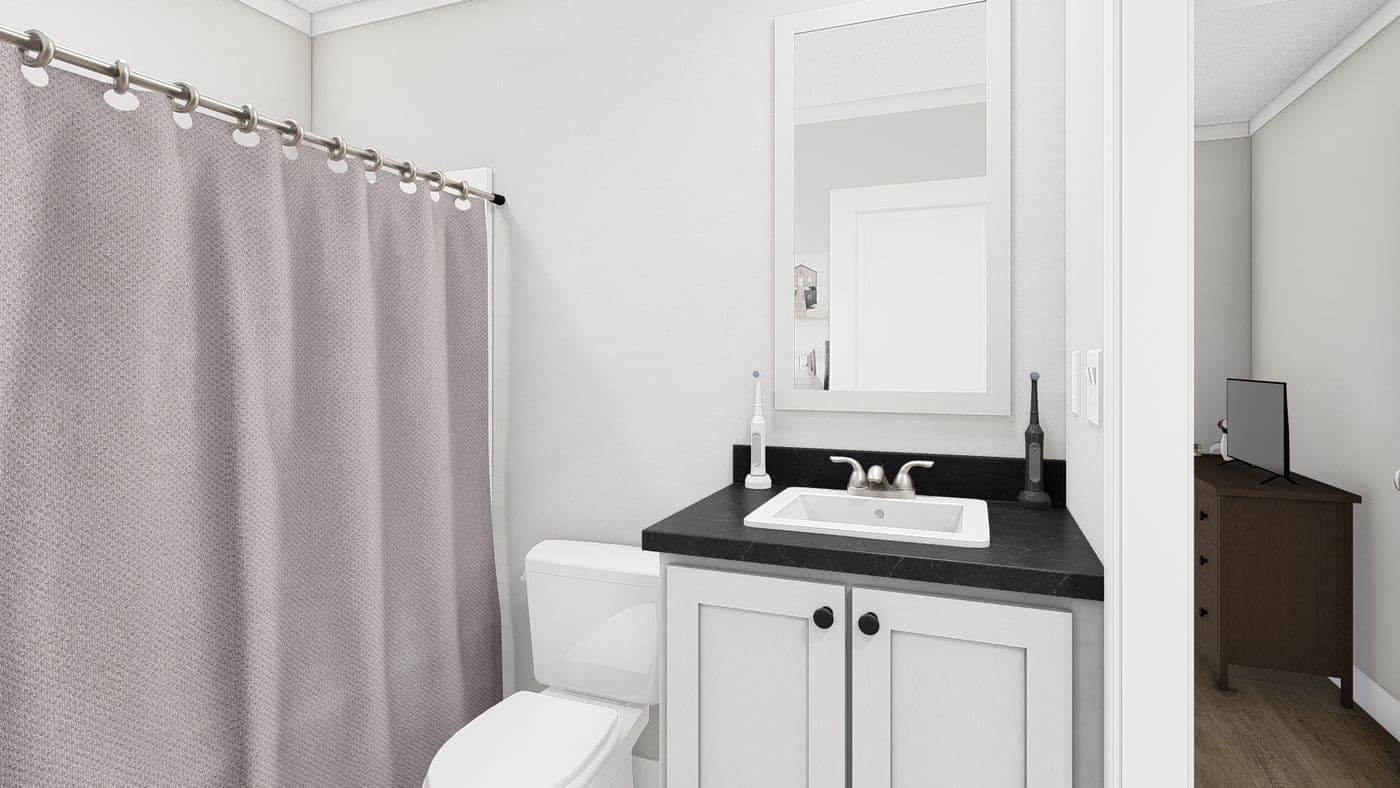 The RHYTHM NATION Guest Bathroom. This Manufactured Mobile Home features 3 bedrooms and 2 baths.