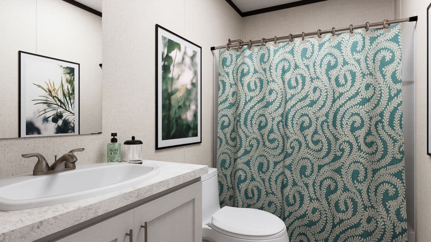 The THE MOUNTAINEER 52 Guest Bathroom. This Manufactured Mobile Home features 3 bedrooms and 2 baths.