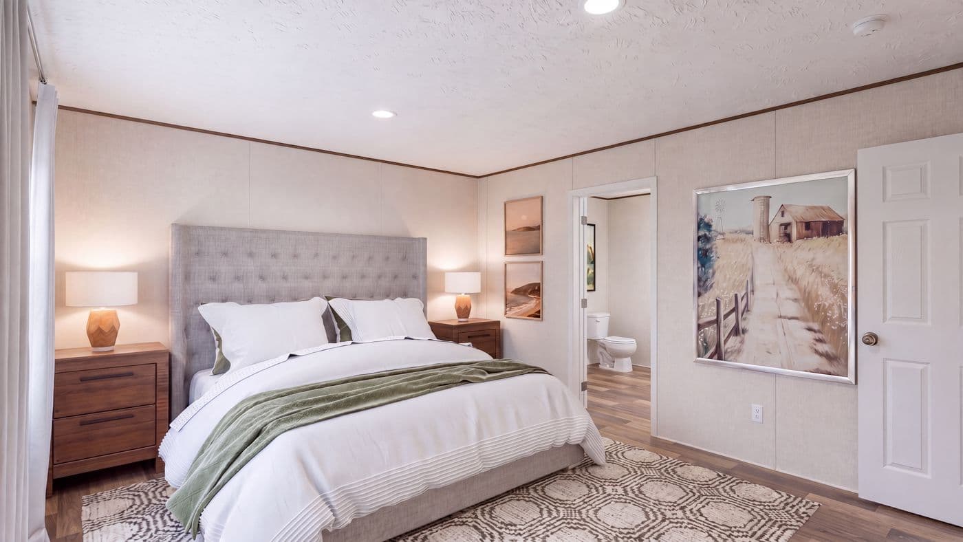 The CEDAR Primary Bedroom. This Manufactured Mobile Home features 3 bedrooms and 2 baths.