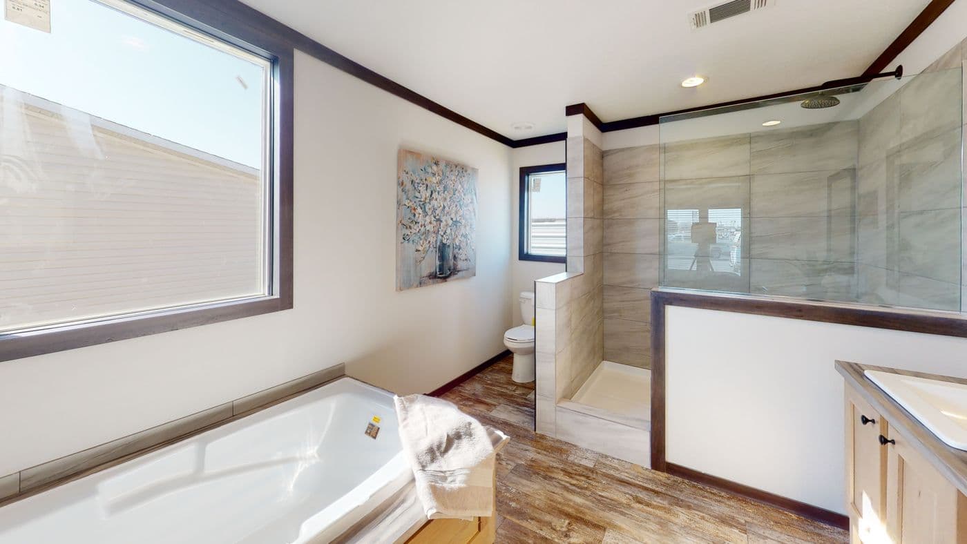 The BOUJEE XL 2 Primary Bathroom. This Manufactured Mobile Home features 4 bedrooms and 3 baths.