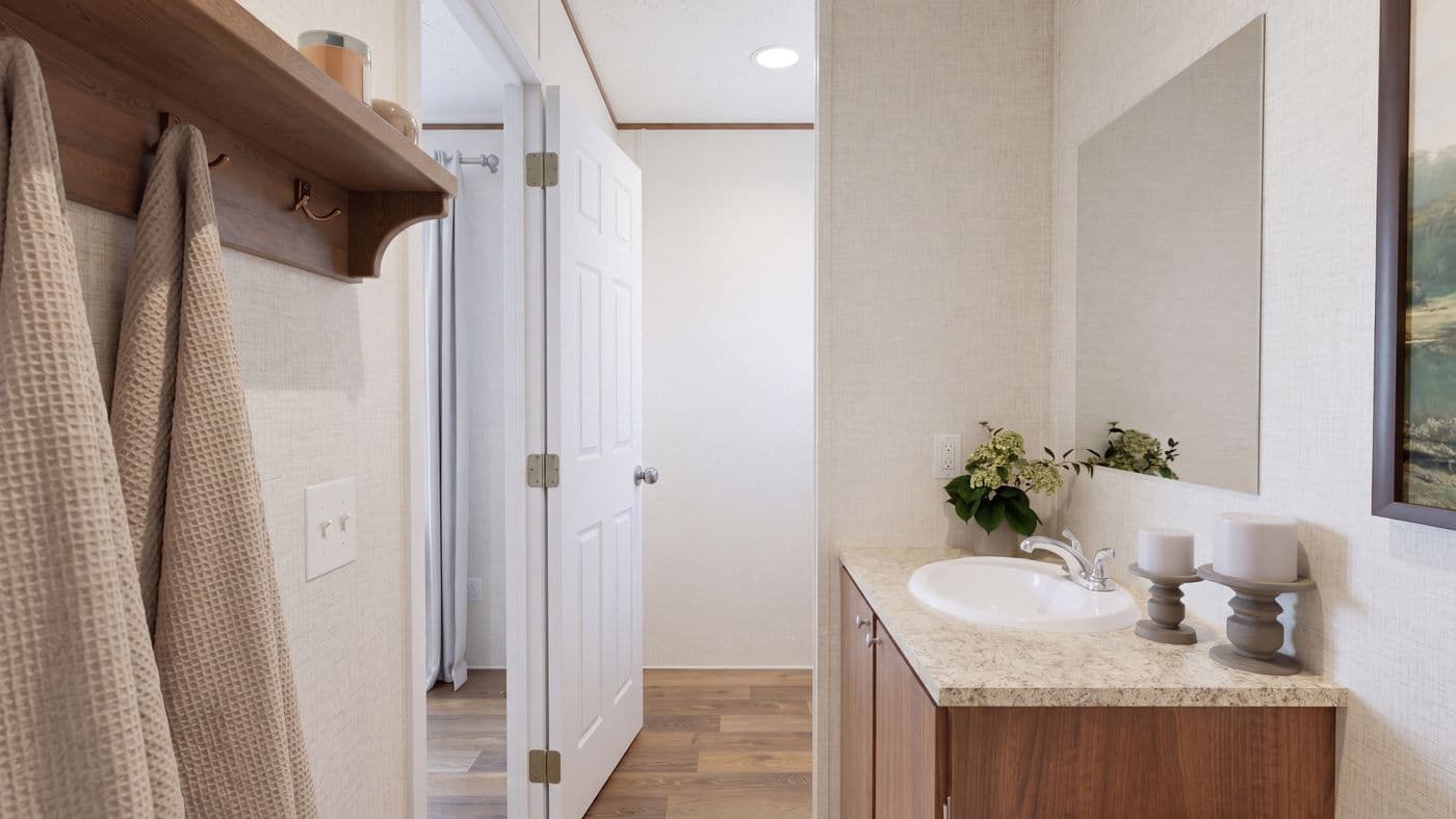 The CYPRESS Primary Bathroom. This Manufactured Mobile Home features 4 bedrooms and 2 baths.