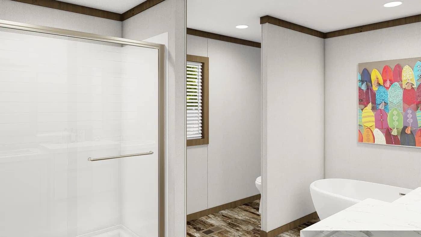 The HOMESTEAD BREEZE Primary Bathroom. This Manufactured Mobile Home features 4 bedrooms and 2 baths.