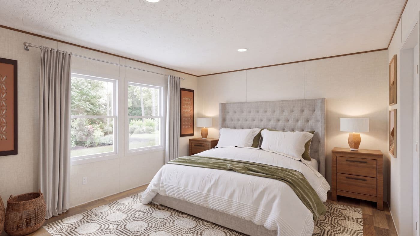 The CEDAR Primary Bedroom. This Manufactured Mobile Home features 3 bedrooms and 2 baths.