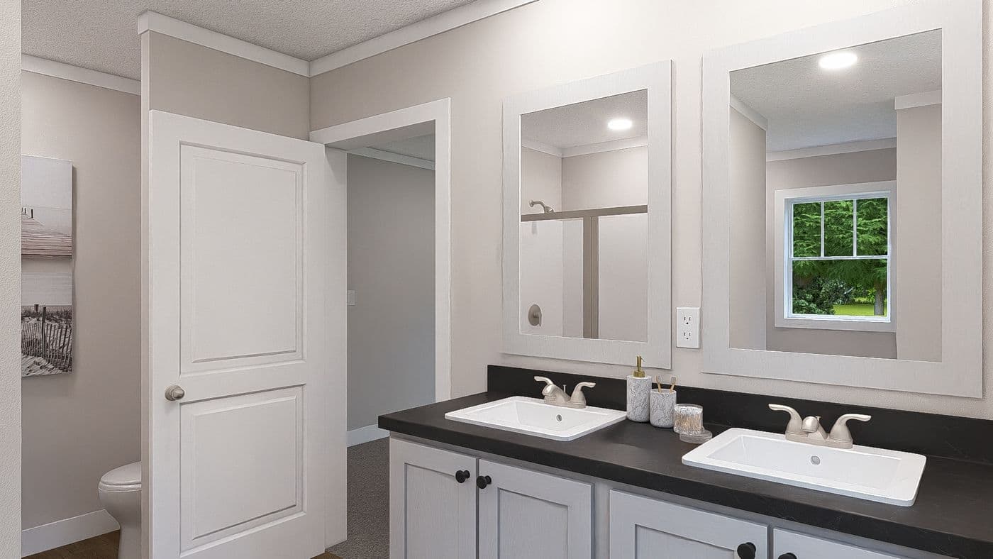 The SHOUT Primary Bathroom. This Manufactured Mobile Home features 3 bedrooms and 2 baths.