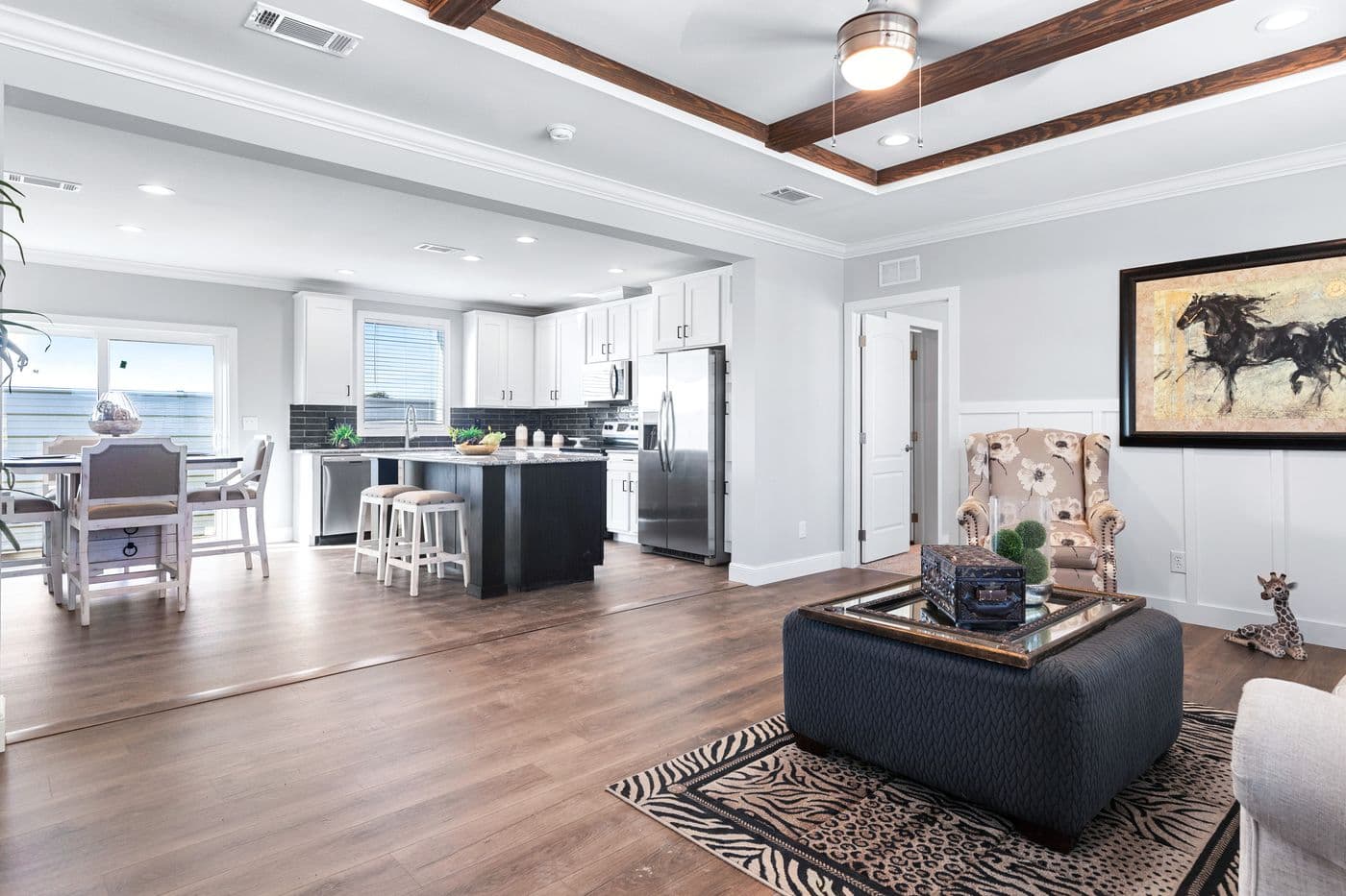 The THE FUJI Living Room. This Manufactured Mobile Home features 4 bedrooms and 3 baths.
