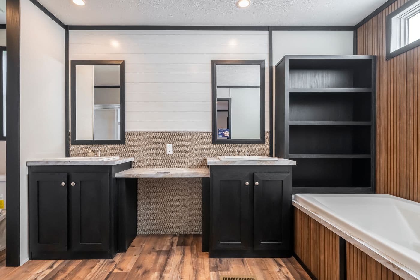 The RAVENWOOD Primary Bathroom. This Manufactured Mobile Home features 3 bedrooms and 2 baths.