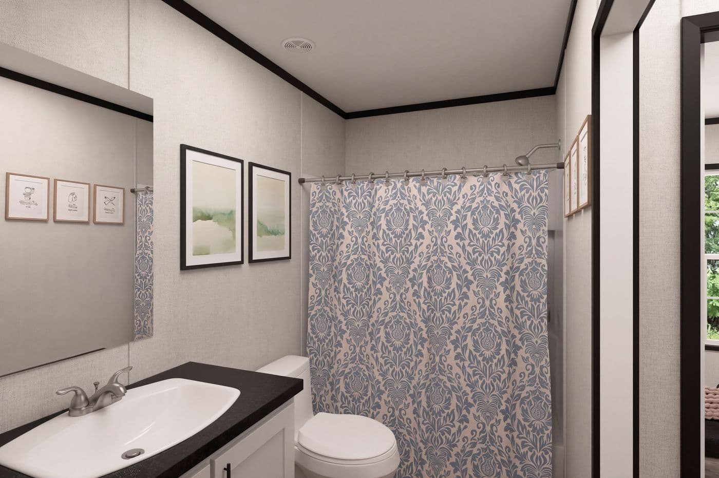 The THE MOUNTAINEER 48 Guest Bathroom. This Manufactured Mobile Home features 3 bedrooms and 2 baths.