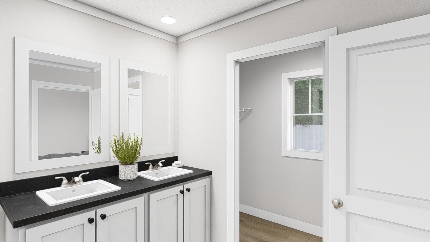The SWEET CAROLINE Primary Bathroom. This Manufactured Mobile Home features 3 bedrooms and 2 baths.