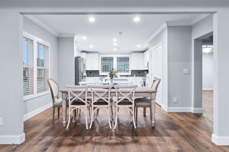 The THE OLYMPUS Dining Area. This Manufactured Mobile Home features 4 bedrooms and 3 baths.