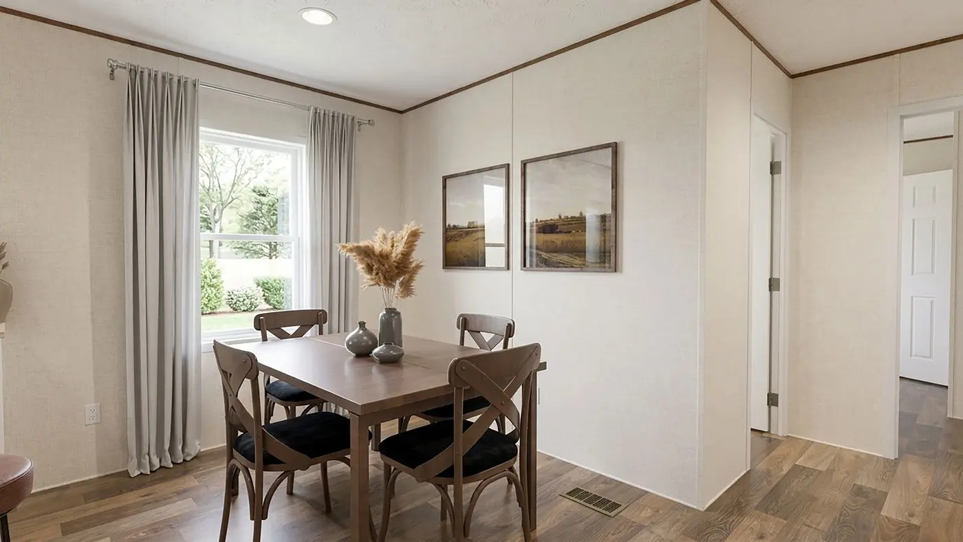 The MAPLE Dining Room. This Manufactured Mobile Home features 3 bedrooms and 2 baths.