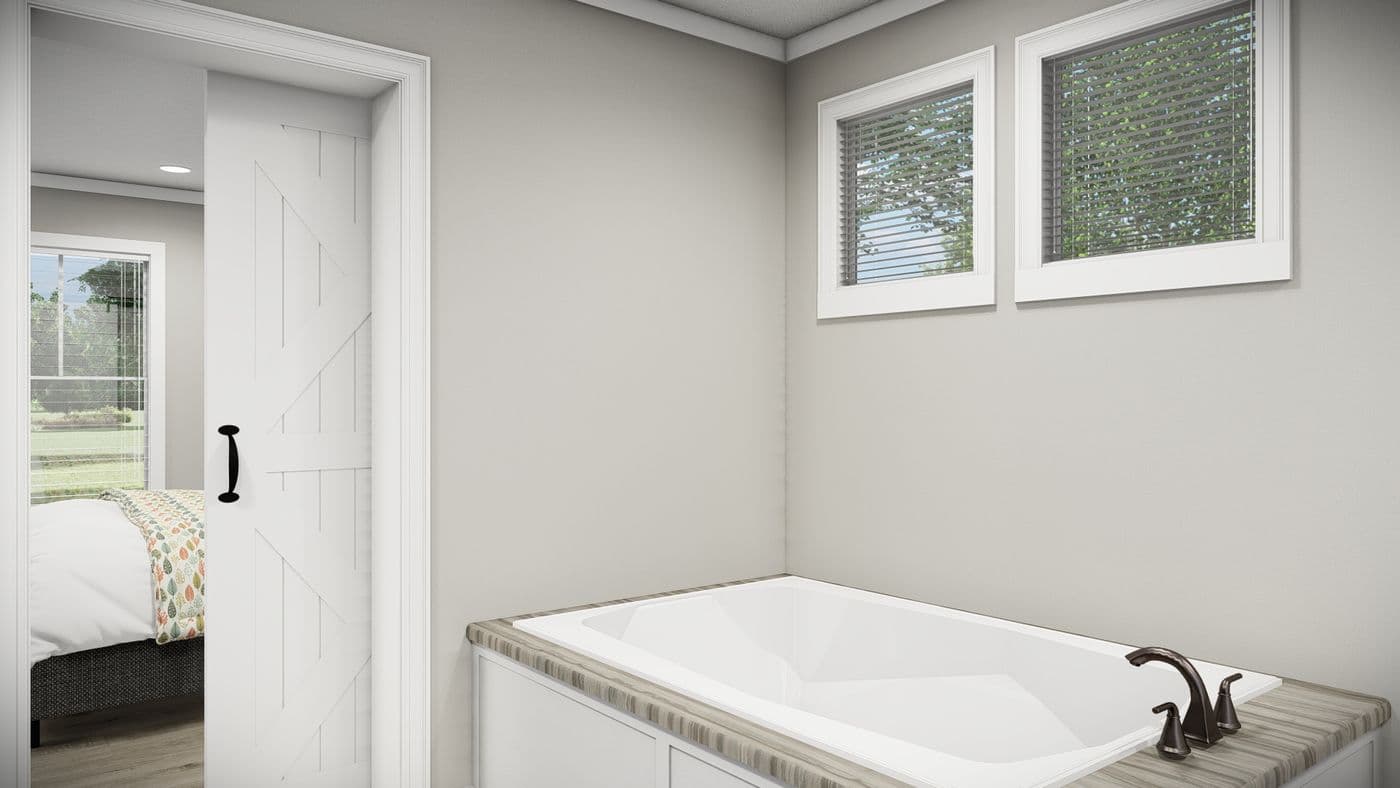 The THE REVERE Primary Bathroom. This Manufactured Mobile Home features 4 bedrooms and 2 baths.