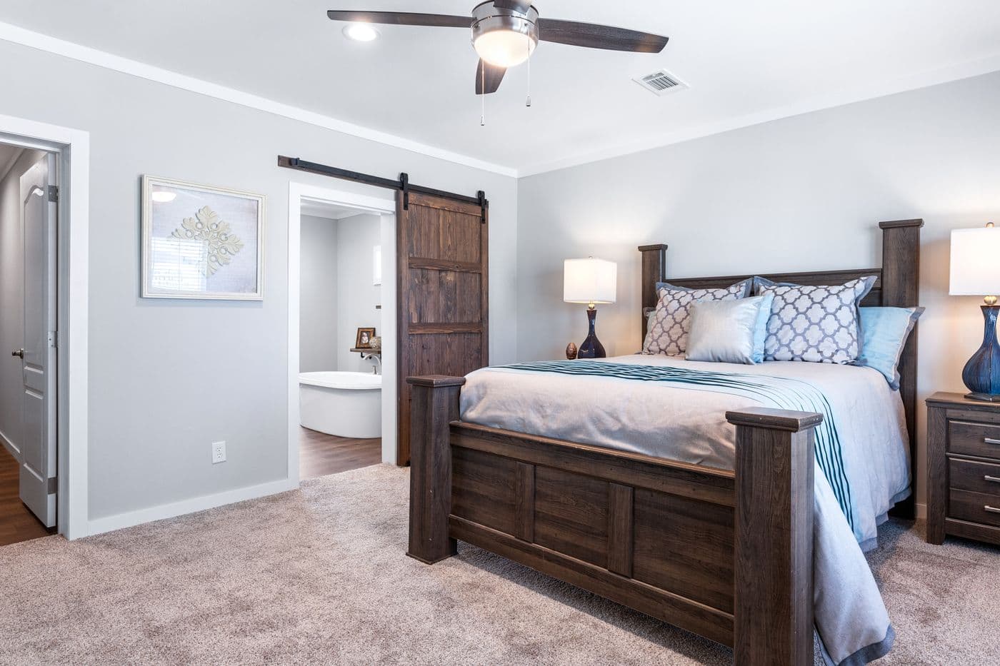 The THE FUJI Primary Bedroom. This Manufactured Mobile Home features 4 bedrooms and 3 baths.
