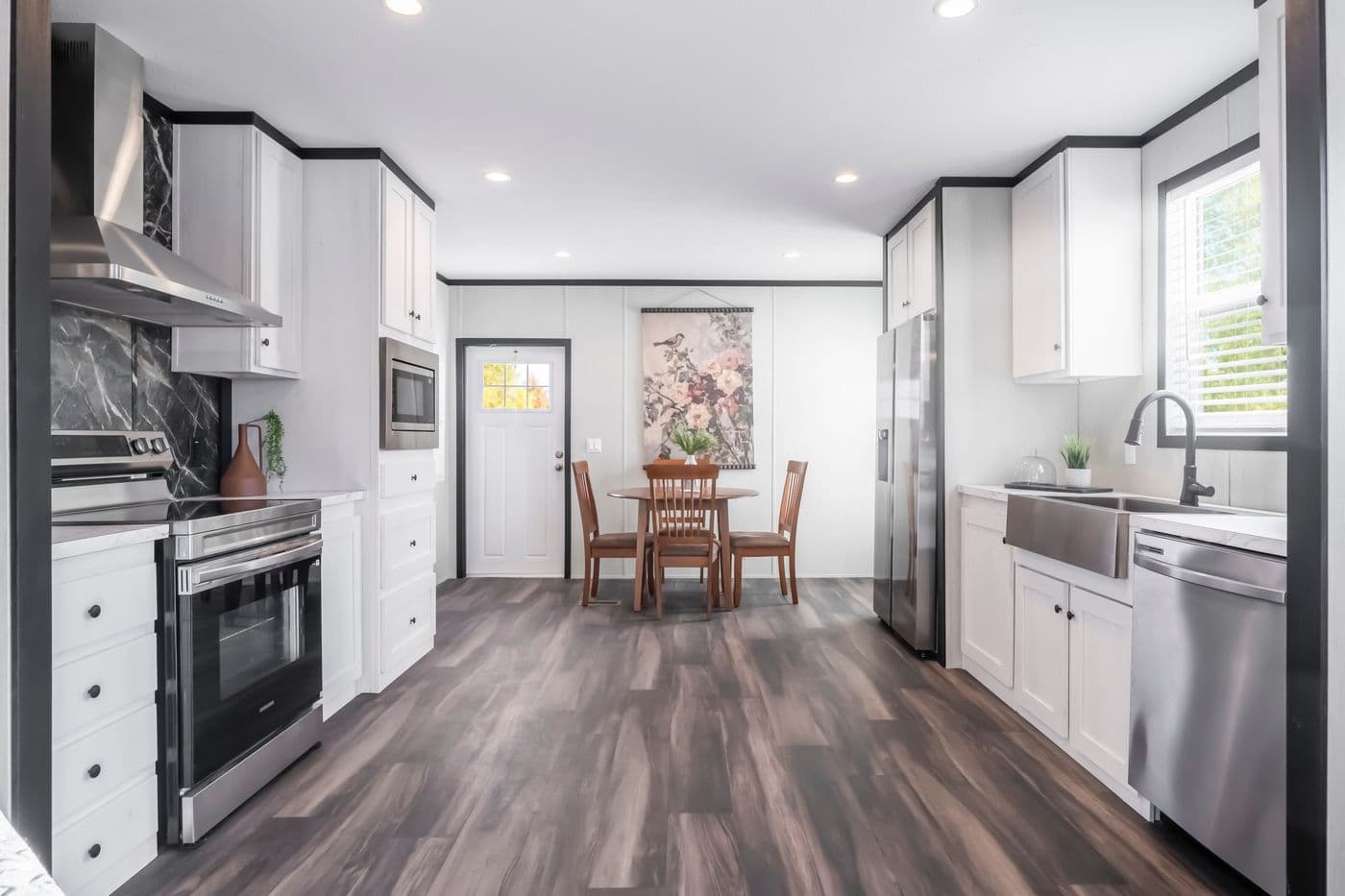 The LIL SOUTHERN CHARM Kitchen. This Manufactured Mobile Home features 3 bedrooms and 2 baths.